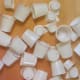 A jumble of clean K-cups and Mini Moo containers will make lovely Barbie hats