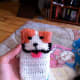 Embroidered face and added crocheted tail.