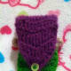 Hair on mermaid cozy is used as flap and fastened with a button.