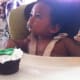 Julian and his polymer clay baby cake topper at his 1st birthday
