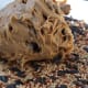Completely cover pinecone with peanut butter.