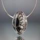 Here you can see the transformation of the rough sketch into the finished ammonite bezel setting and backplate.
