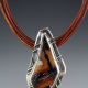 This Indian Paint Stone pendant's backplate is a terrific example of echoing the stone's pattern onto the surrounding backplate through texture.
