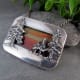 This sunset jasper stone set from the back creates a color-banded sky behind the dimensional forest trees balanced by a smooth, polished silver frame.