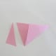Take a pair of scissors and trim off part of the paper at the other end. Be careful not to cut the triangle.