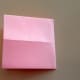 Fold the paper in half from right to left with the right side overlapping the left.