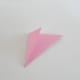 Fold the trimmed end of the paper and tuck it in between the layers of folded triangles.
