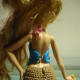 Back view of Ashlynn Ella's Granny Square Halter Top and Mini Shorts