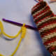 Make the Beak with about 3-4 chain stitches. Leave long ends to attach it.