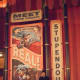 My husband with one of the posters in Storybook Circus Fantasyland in Magic Kingdom.