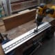 Using a jig to drill the dowel holes for fixing the planks together.