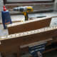 Applying the glue and inserting the dowel joints.
