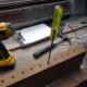 Cleaning out the drilled holes prior to gluing.