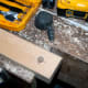 The hole drilled to size to fit the pin of the caster wheel