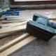Sander with fine grade sanding paper to make the timber smooth.