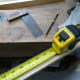 Measuring the wood for cutting.