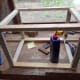 Screwing the frame together.