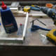 Screwing the angle brackets in place.