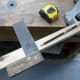 Using a square to mark the cut line.