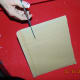 Step #2 Cut out two identical pieces, one will be the front, and the other will be the back covers. Cut a piece the length of the book and the height of the manuscript for a spine.