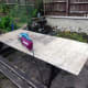 An old garden shed door ready for belt sanding in preparation of recycle the plywood.