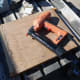 Gluing and pinning the plywood in position over the side frames.