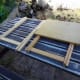 Both folding tables ready for dismantling; table top already removed from one table.