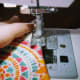 Where my fingers are is where I am starting and stopping the tiny stitch. The hole is between them.
