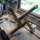 Holes drilled slightly smaller than steel thread of feet, and plastic feet screwed in.