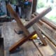 The hardwood timber cut to length and screwed to the base of the post, and to each other in a crisscross pattern for maximum strength and durability.