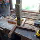 Stand, with base plate slotted in, stood up on its legs.