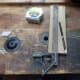Marking up the base plate to drill the two holes for fitting the wooden pegs.