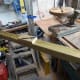 Pencilling around the inside of both holes in the base plate, to mark out where to drill the holes in the post.
