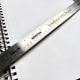 An 18" stainless steel cork-back ruler