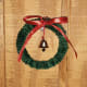 Attach a tiny bell in the middle of the small wreath.
