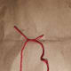 Add string or yarn to top of the wreath and tie. The string makes it possible to hang the wreath.