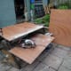 Using a circular saw to cut the three sections to the overall size for the selves.