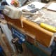 Using wooden mallet and chisel to knock out the cut slotting joint.