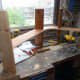 Joining the end supports to the middle shelf.