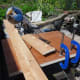 Cutting the two outer side supports to length from pine floorboards leftover from making the bookcase inside the office wardrobe.