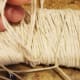 Create a hanger using a piece of twine. Fold it in half so the ends meet. Flip your moon over so the back is facing you, pull the ends through the middle.
