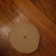 Line your cardboard circle up to cut a hole in the center.