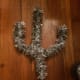 Wrap garland around the wire form to create your cactus. Leave the bottom section exposed. You will wrap the wire just to where the form meets the top of your container.