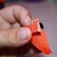 Repeat the fold up and down one last time so there are two folds in this one side.