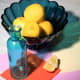 A still life set up with turquoise blue glass and lemons, for the painting "Lemons and Teal".