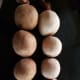 Dryer balls in panty hose, ready for the washer. I found it was better to cut them apart before washing, as leaving them in a string caused them to be deformed.