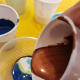 Layering colors of paint.
