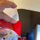 White base, red knit, stretchy bottom, and heart cover - all with raw edges together.