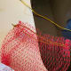 Sew ribbon to the bottom to keep in place. Fold an inch down around the top edge and lace through with a little cord.