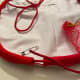 Repeat from the other set of openings. Both openings will have extra length to tie into a knot.